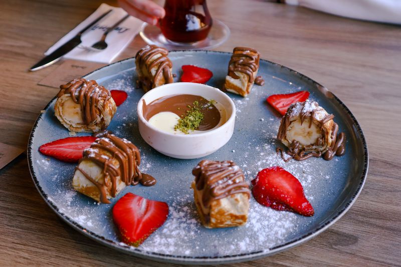 Nutella pizza dessert drizzled with toppings